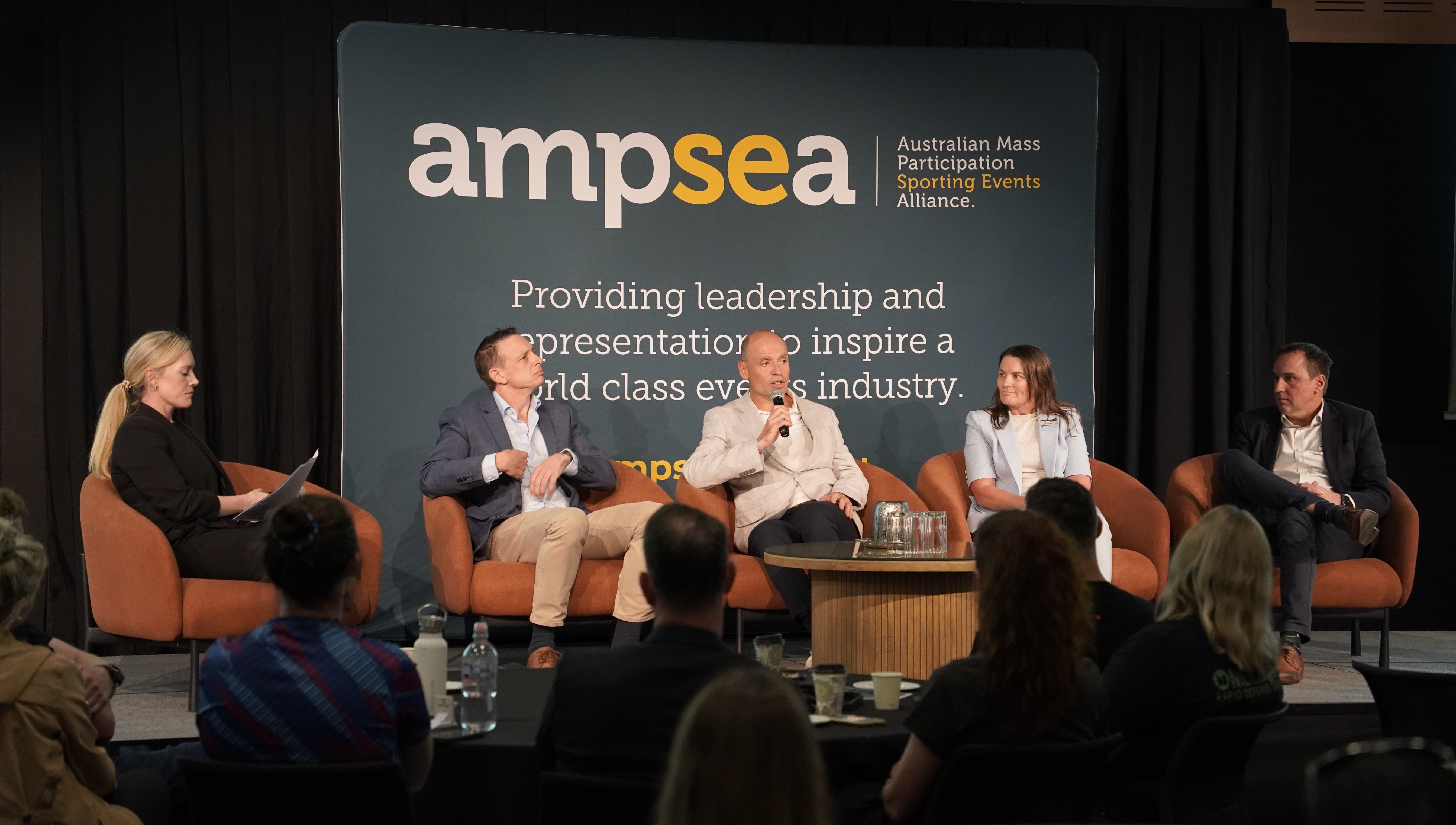 Brisbane 2032 panel discussion on stage at the AMPSEA Conference
